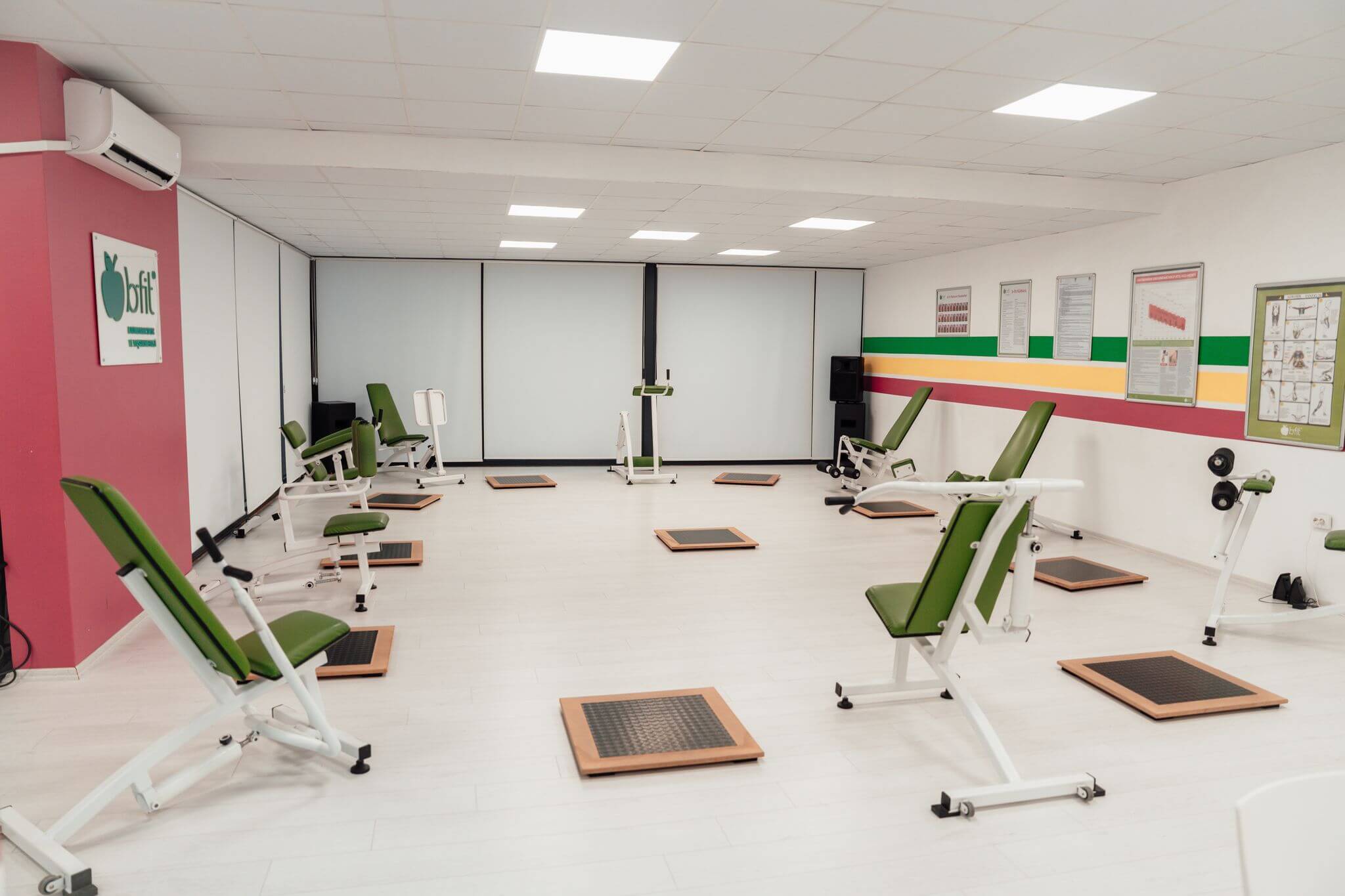 Bright and spacious gym interior featuring modern green exercise machines in Yalova.